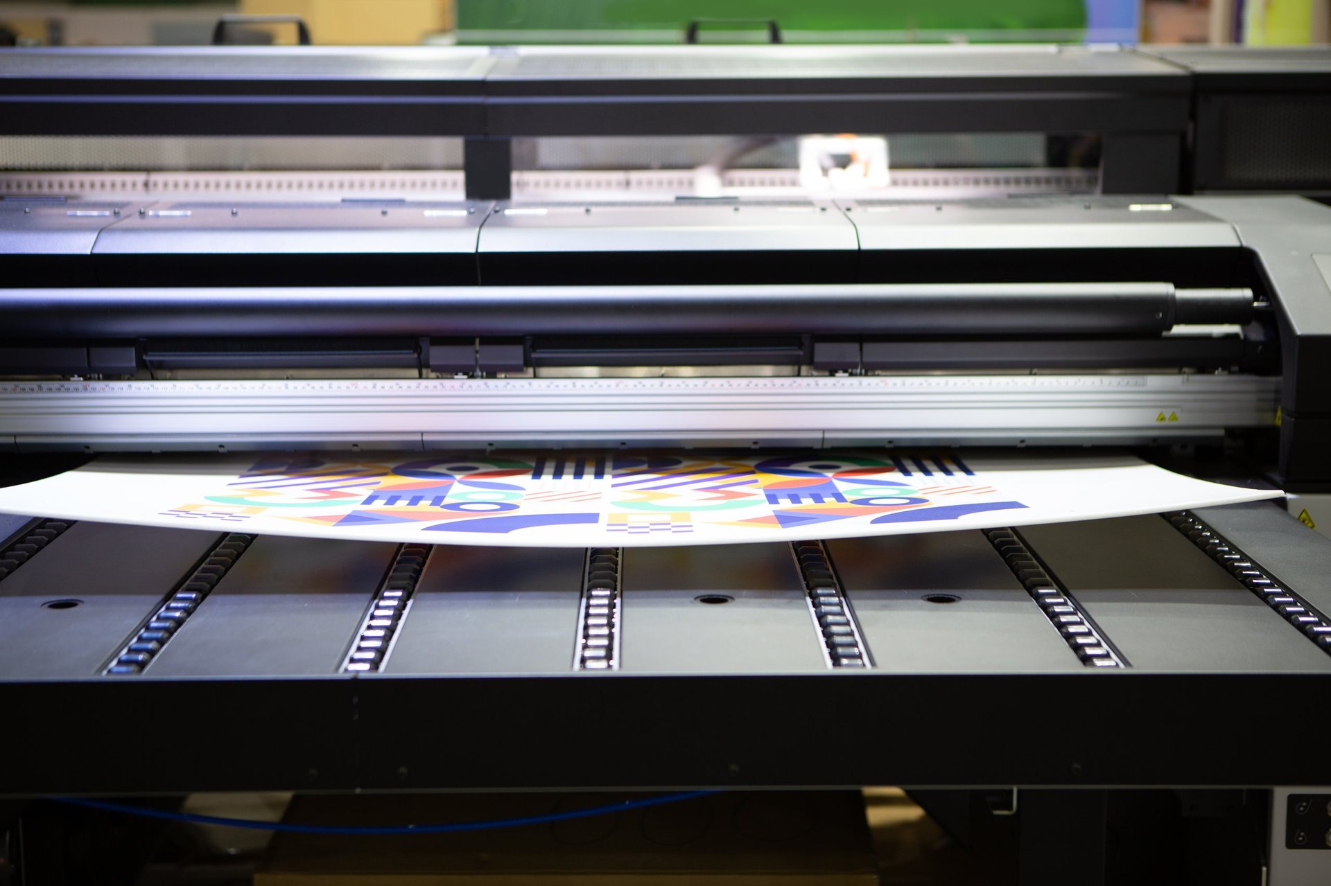 Large format latex printer in action — custom apparel DTF printing