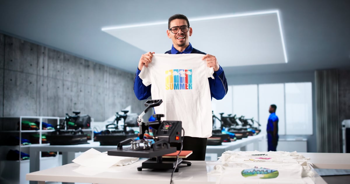 Custom Shirt Design: Latino Worker Using Heat Press Transfer Machine