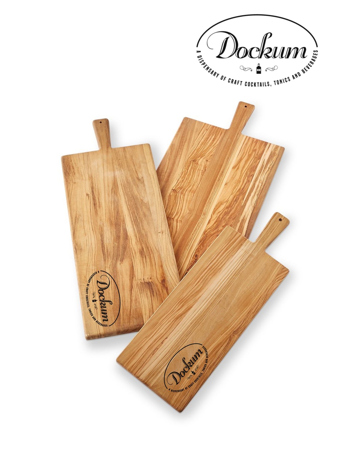Three wooden cutting boards with Dockum branding and handles arranged on white background