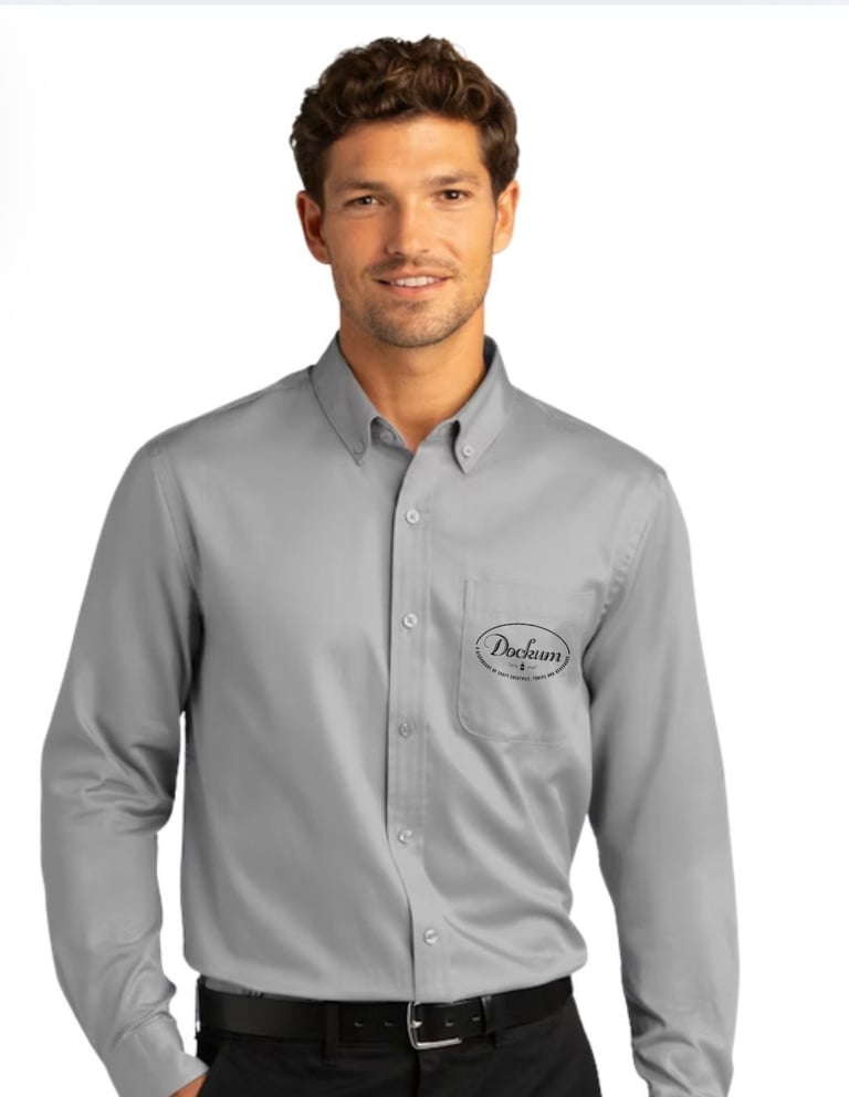 Man wearing gray long-sleeve button-up shirt with Pacleam logo