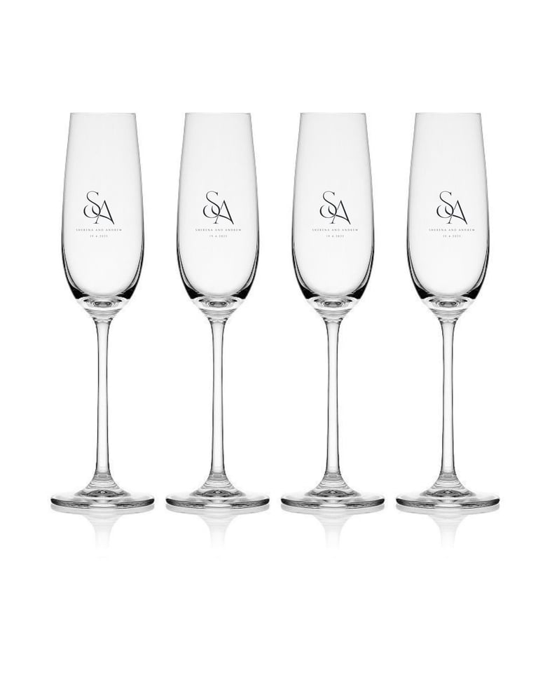 Set of four etched champagne flutes with SA monogram