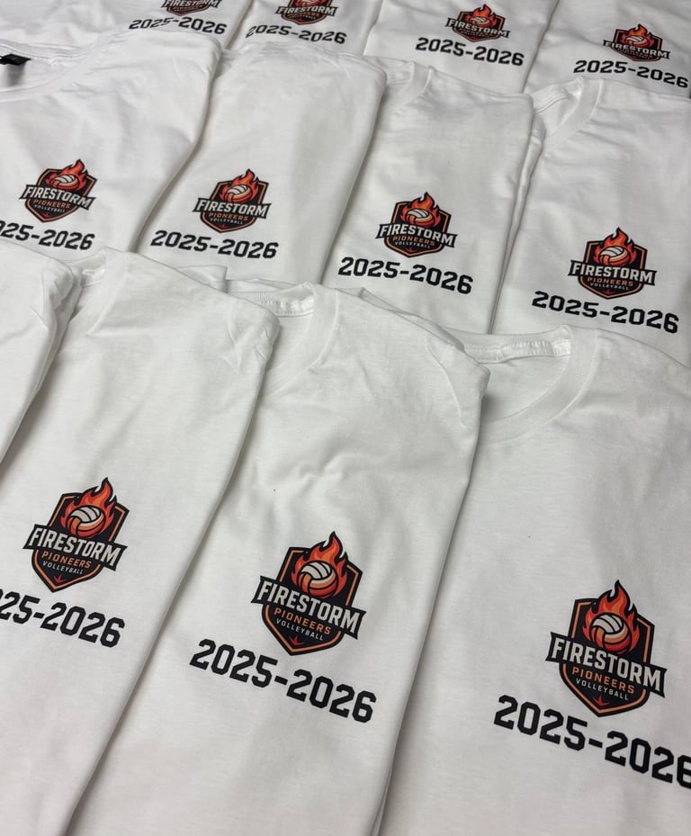Multiple white socks with Firestorm logo and 2025-2026 text printed on them, laid flat in rows