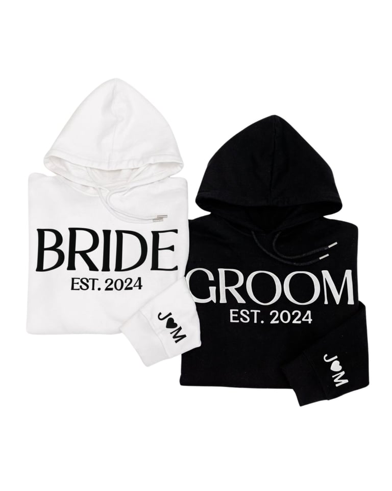 White bride and black groom hoodies with EST 2024