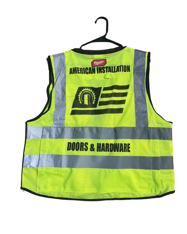 Neon yellow safety vest with reflective gray stripes