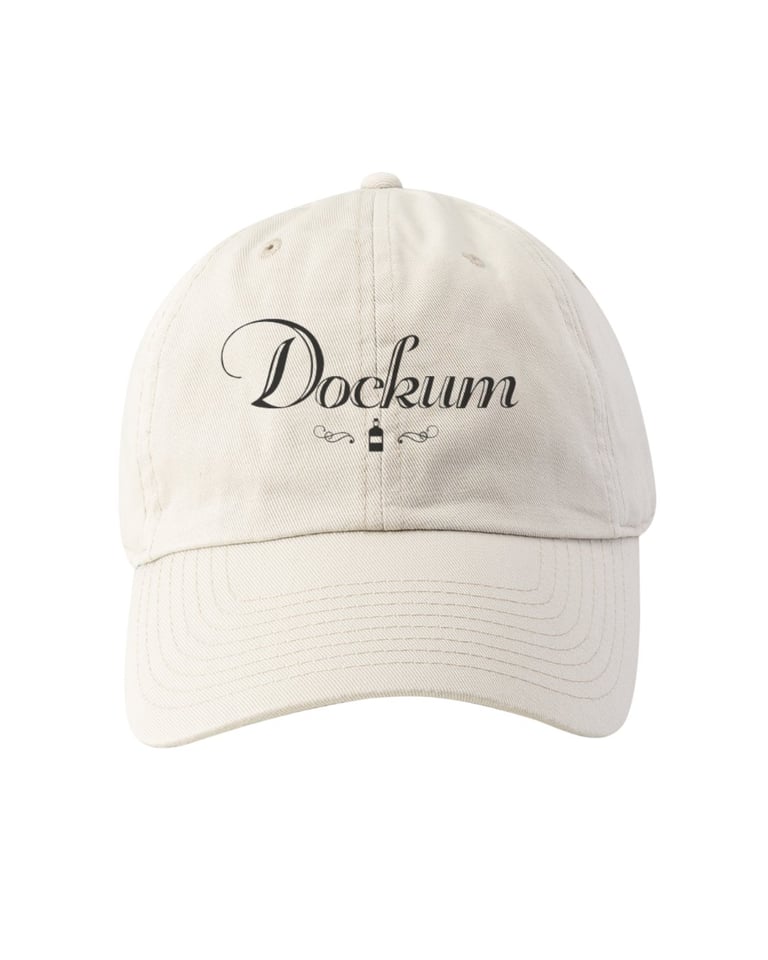 Cream-colored baseball cap with Dockum script logo embroidered on front
