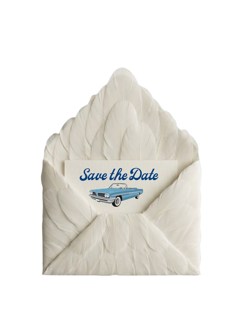 Open white envelope with Save the Date card featuring blue vintage car illustration