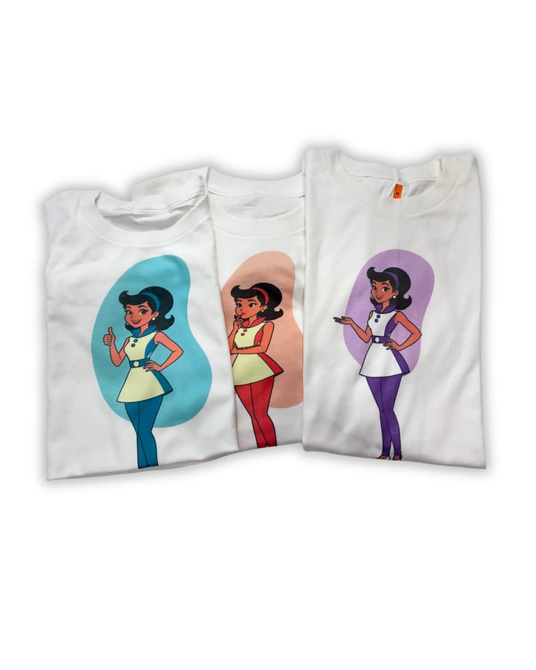Three white t-shirts featuring cartoon illustrations of women